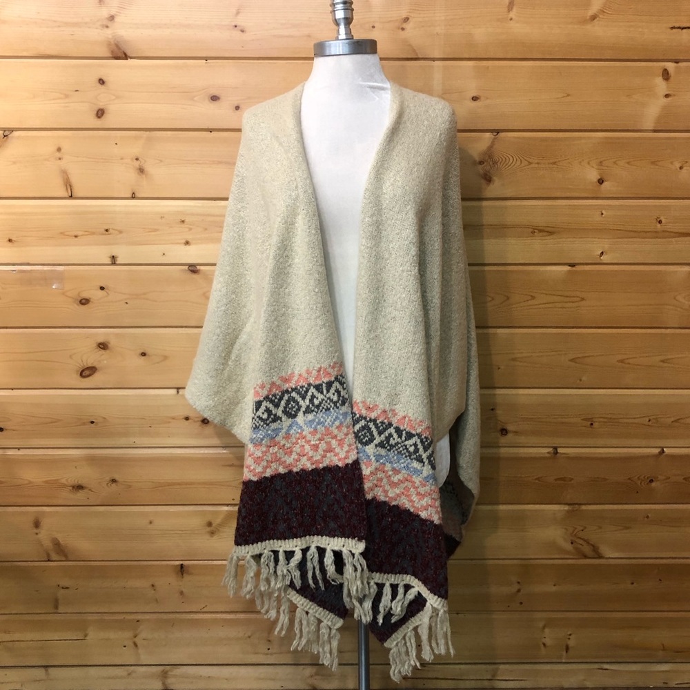 WHITE PONCHO WITH FRINGE AND FUN PATTERNS